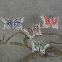 BUTTERFLY 2.75" W/SIL GLITTER  4 ASST